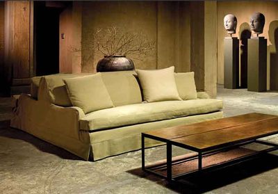 Sofa Elliot with slipcover and skirt designed by Axel Vervoordt