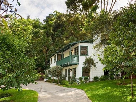 A charming 2-story Monterey Colonial farmhouse