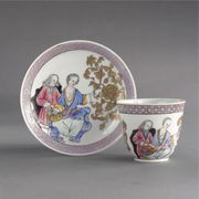 A CHINESE EXPORT BEAKER AND SAUCER
CIRCA 1735
