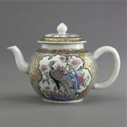 A CHINESE EXPORT FAMILLE-ROSE SPHERICAL TEAPOT AND COVER
CIRCA 1730
