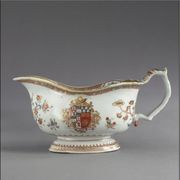 A CHINESE EXPORT ARMORIAL SILVER-SHAPE SAUCEBOAT
CIRCA 1724
