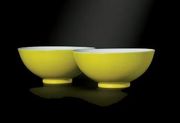A pair of 18th c. Chinese lemon-yellow enamelled bowls