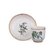A TOURNAI CUP AND SAUCER FROM THE SERVICE "A L'HERBIER", 18TH CENTUR