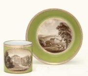 MEISSEN (MARCOLINI) GREEN-GROUND TOPOGRAPHICAL CABINET-CUP AND SAUCER 
