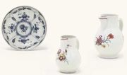 TWO BADEN-BADEN BALUSTER HOT-MILK JUGS AND A BADEN-BADEN BLUE AND WHITE SAUCER
