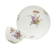 A BADEN-BADEN TEACUP AND SAUCER