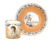 A GOTHA ORANGE-GROUND COFFEE-CAN AND SAUCER