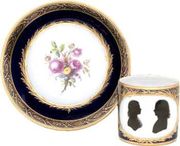 A BERLIN BLUE-GROUND DOUBLE PORTRAIT COFFEE-CAN AND SAUCER 
